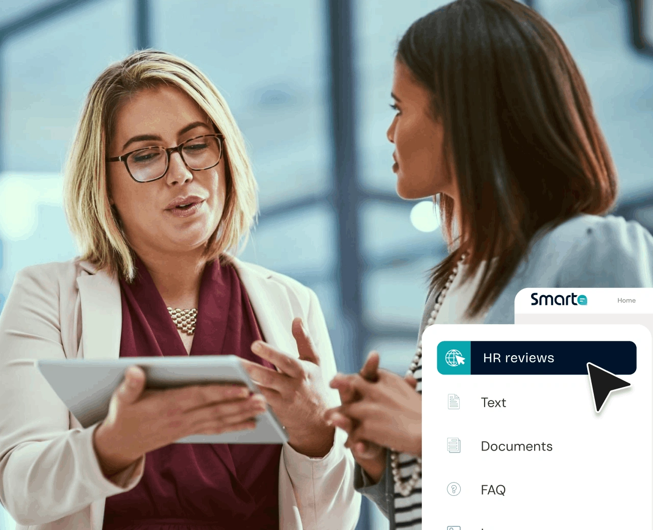 Two recruiters review a shortlist together, not a folder of 200 CVs